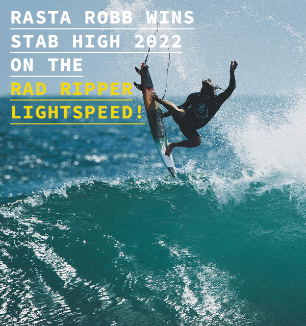 Surfer performing a trick on a wave, celebrating a win.