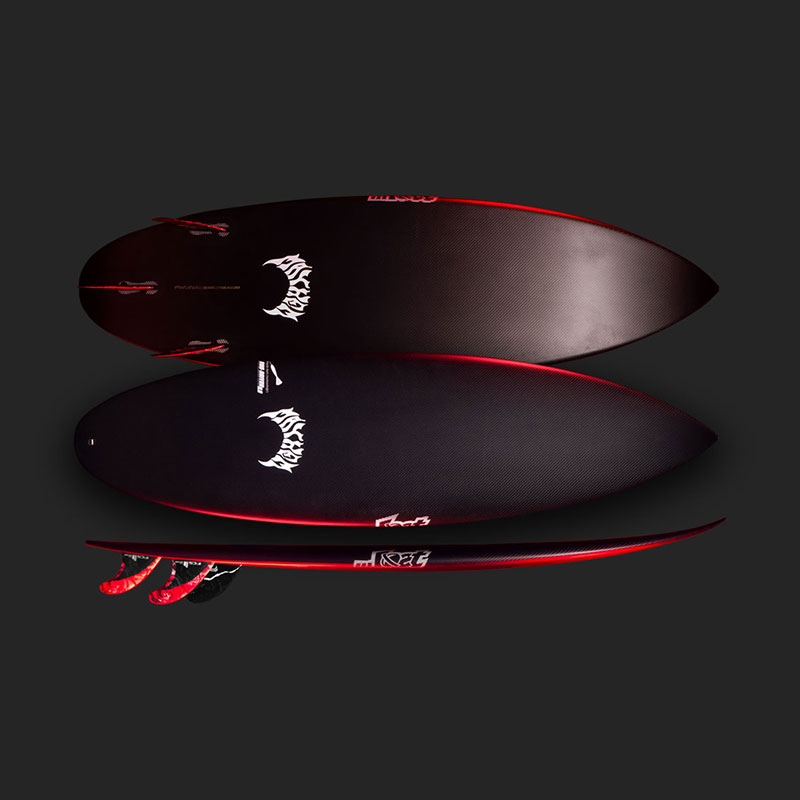 Two surfboards are displayed on a dark background. The boards are black with red accents and feature unique designs on the top. One board is positioned above the other, showcasing their shapes and fins.