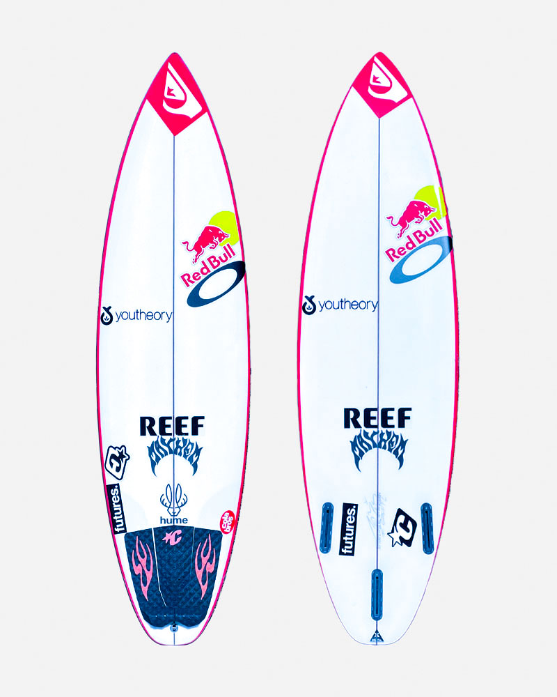 Two surfboards with colorful designs and logos.