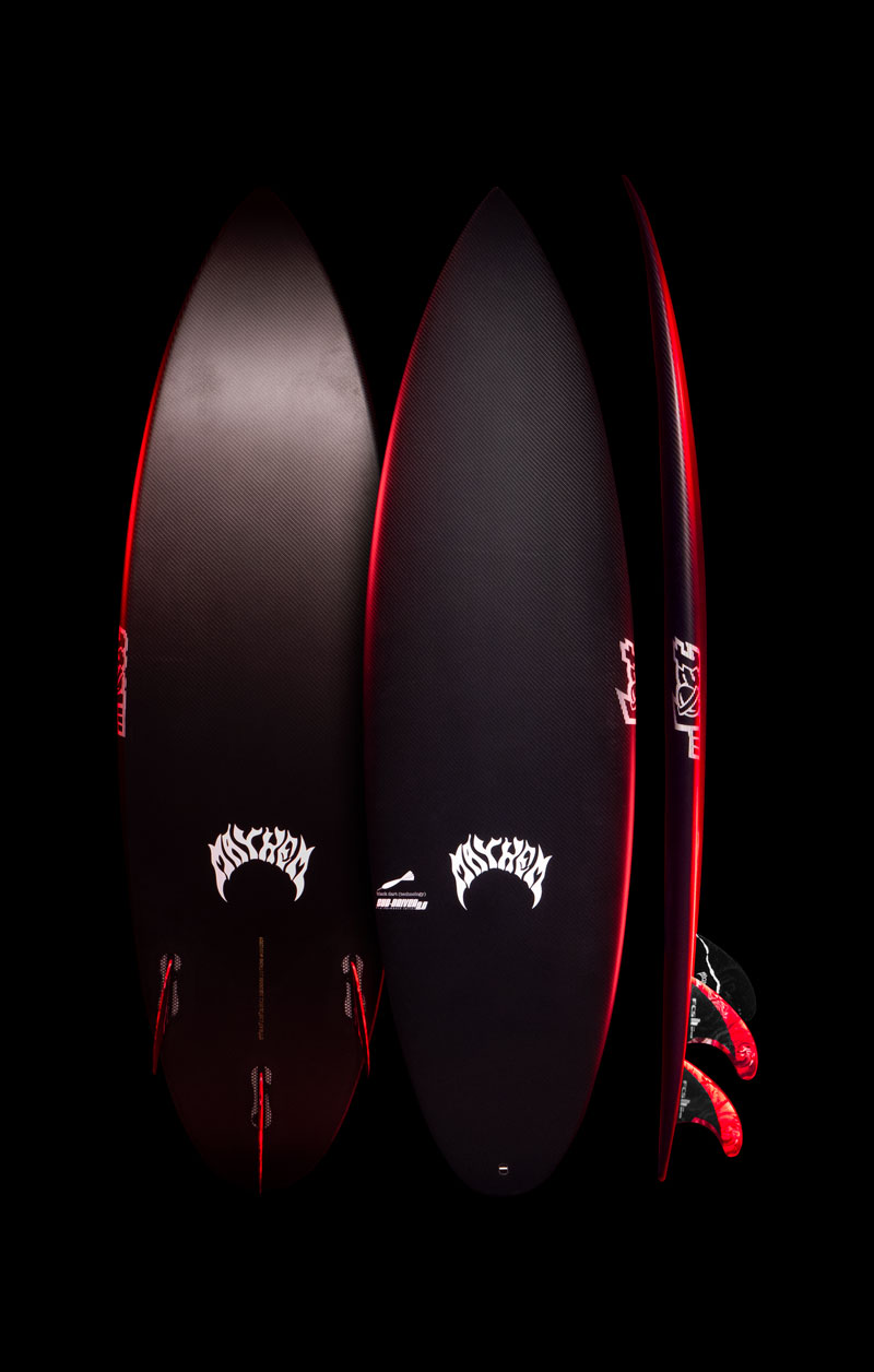 Three surfboards displayed against a black background.