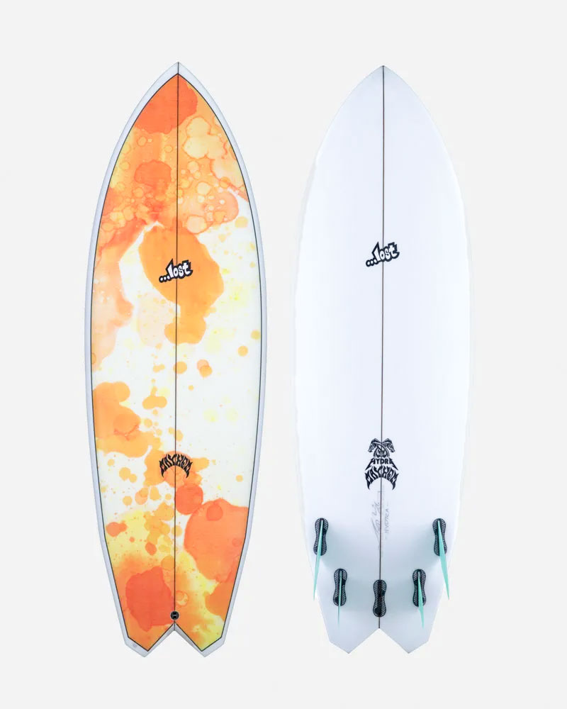 Two surfboards side by side, one colorful and one white.