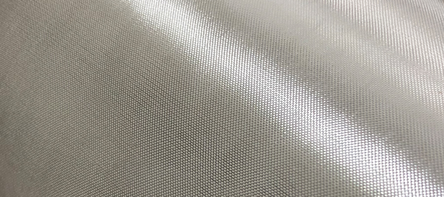 Close-up of textured glass fiber fabric surface.