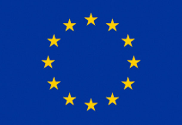 A blue flag with a circle of twelve yellow stars, representing the European Union.