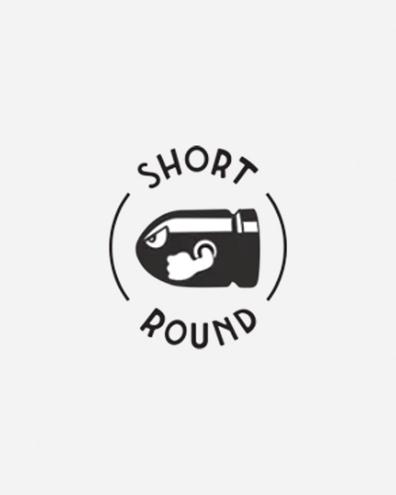 Logo featuring a bullet with a face, text "SHORT ROUND.
