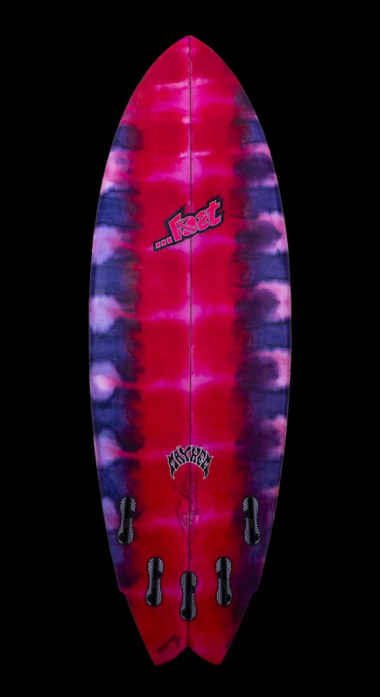 Colorful surfboard with a tie-dye pattern and logos.