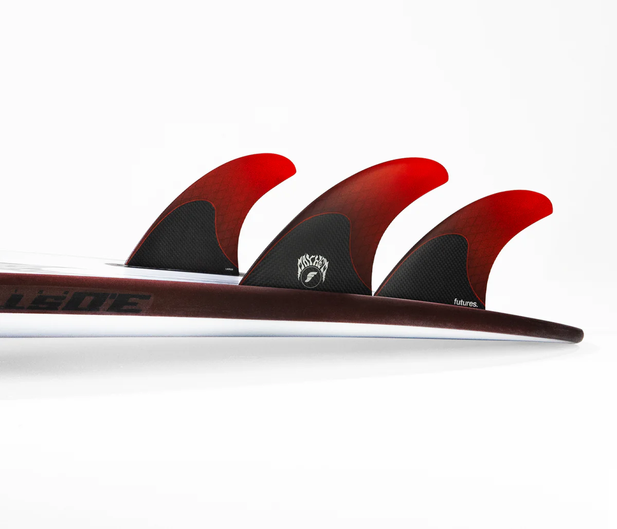 Three red surfboard fins on a white background.